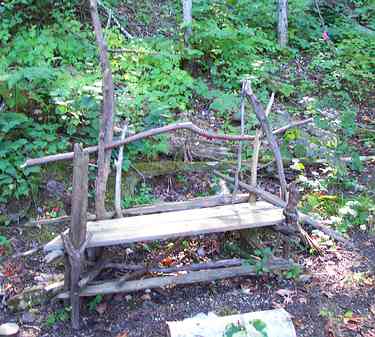 Bench made with beaver chewed sticks.